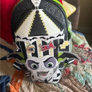 Beetlejuice Striped Backpack glows in the dark arms come out when you squeeze